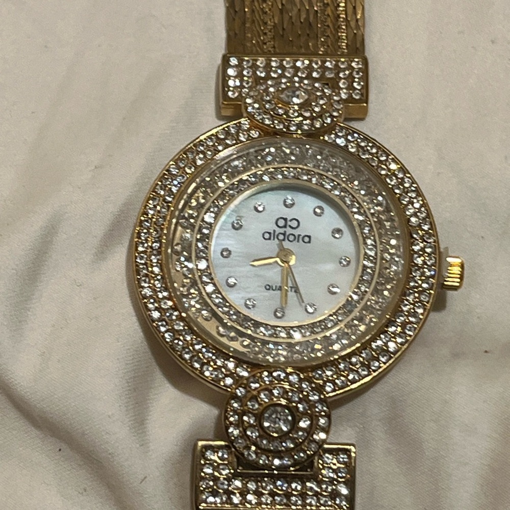 Aldora gold-toned women's quartz watch with a mesh band
